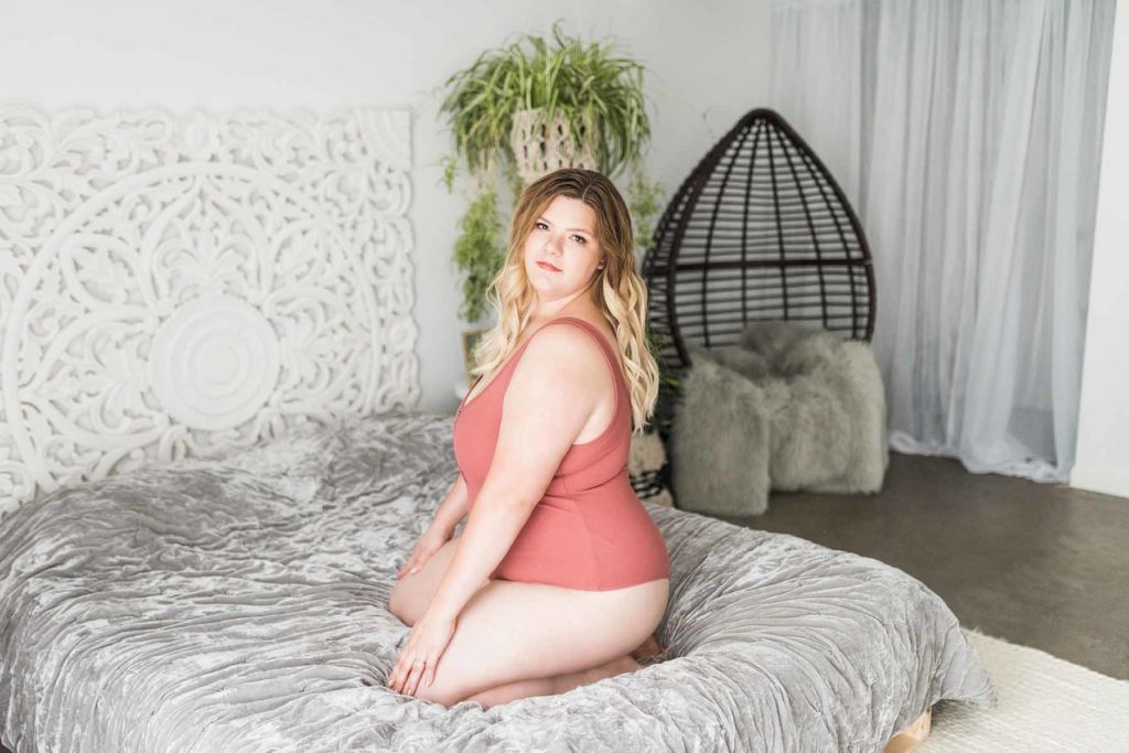 Woman Posed Peach Lingerie Boudoir Photoshoot